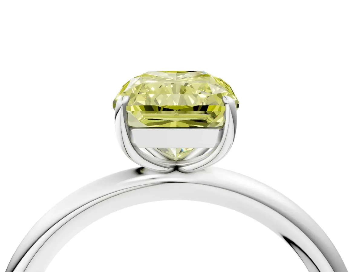 Fancy Yellow Radiant Cut Solitaire Diamond Ring with Four-Prong Setting on a Plain Band Platinum