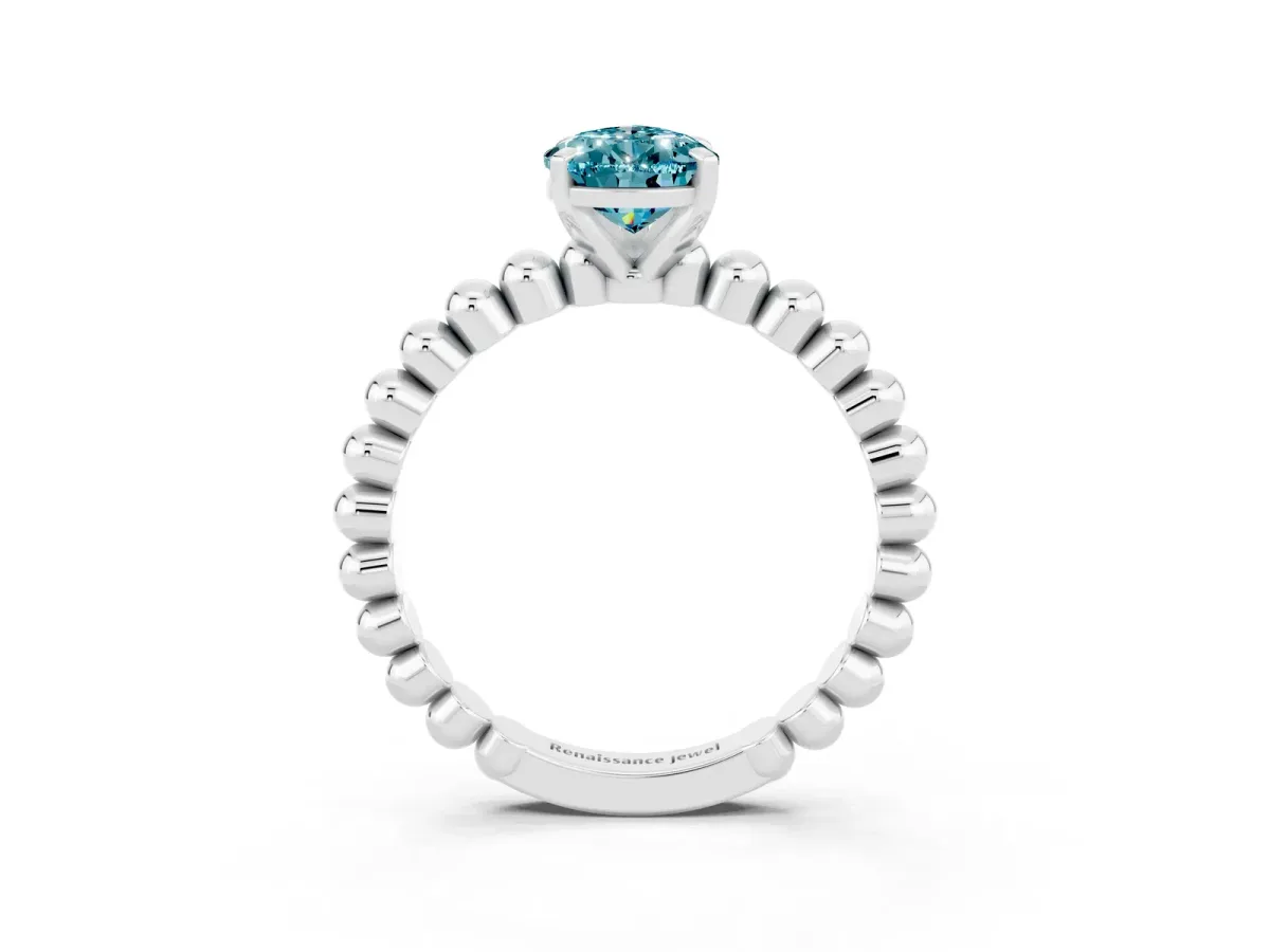 Pear Cut Blue Topaz Solitaire Ring with Beaded Band and Prong Setting Silver