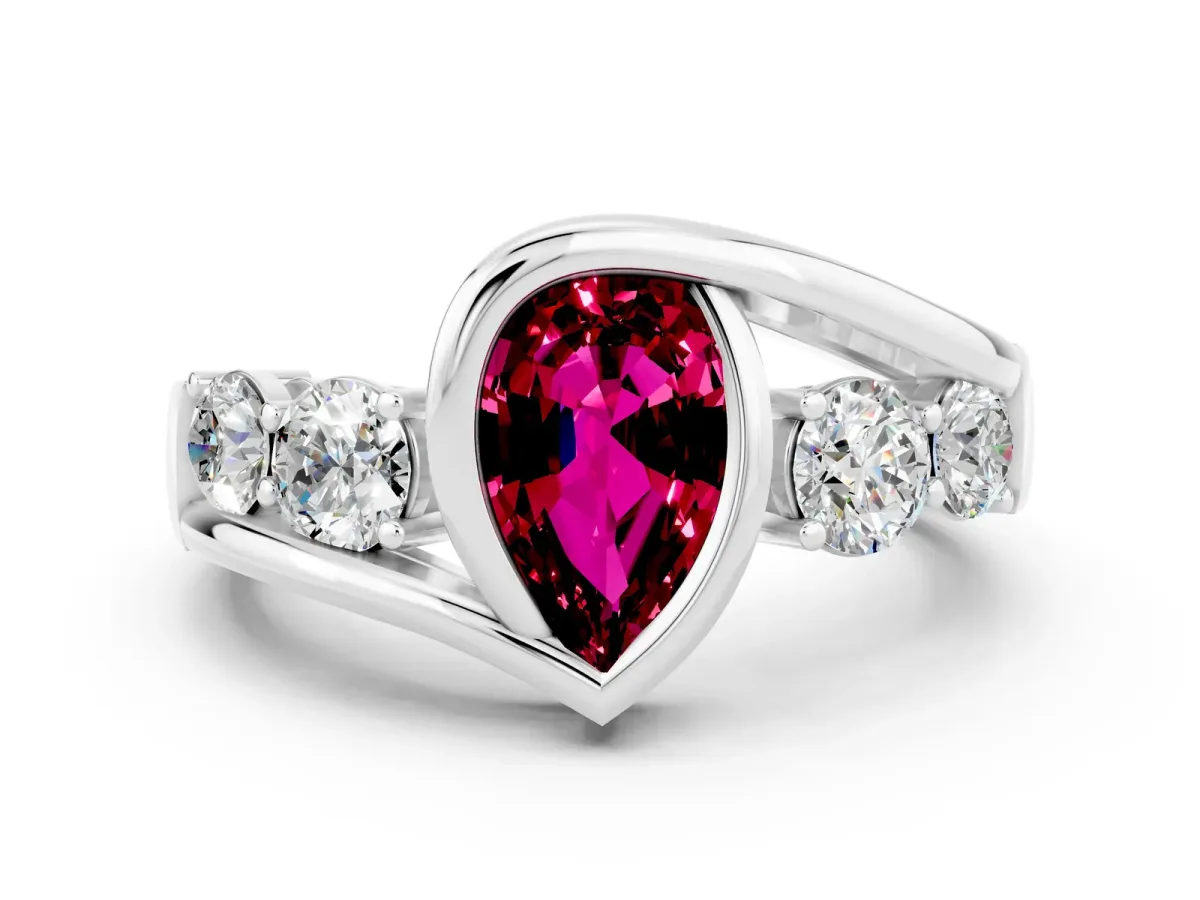 Bezel Set Pear Cut Garnet Bypass Ring with Round Accents Platinum