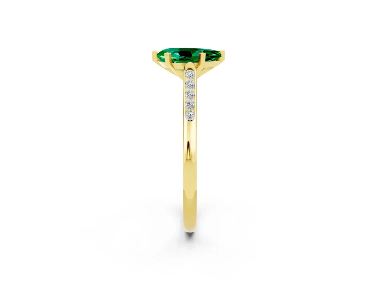 Pear Cut Emerald Solitaire Ring with Channel Set Round Band and Prong Setting Yellow gold