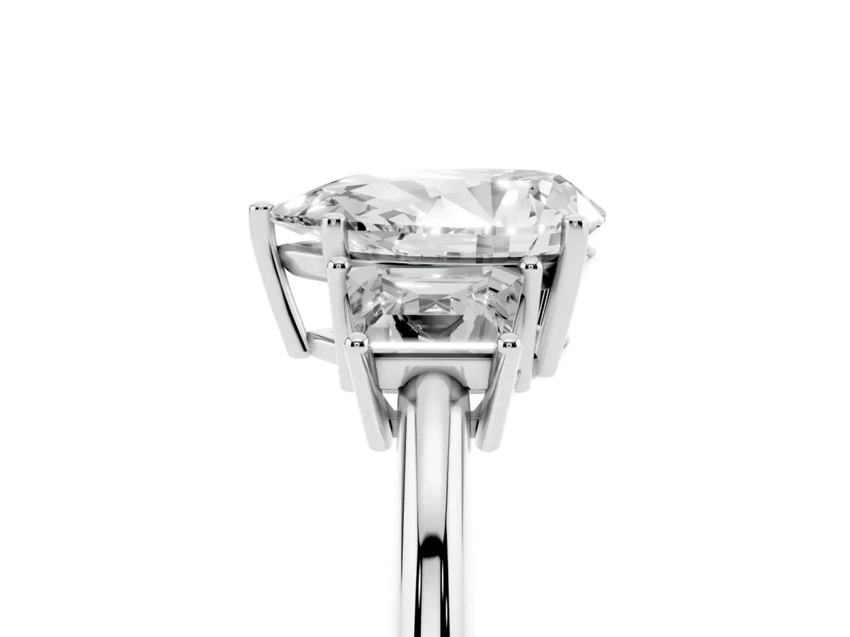 Pear Cut Diamond Three-Stone Ring with Trapezoid Side Stones and Prong Setting Platinum
