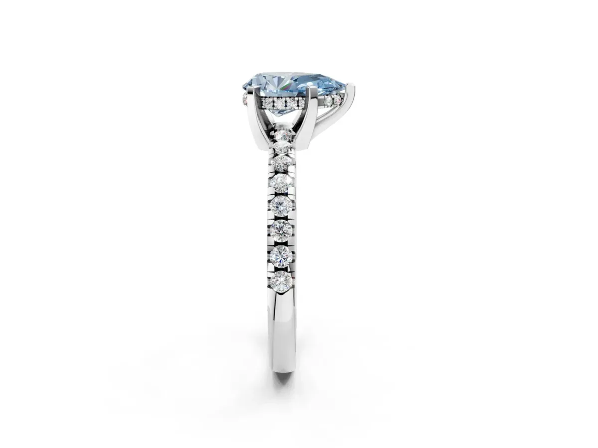 Fancy Blue Pear Cut Diamond Solitaire Ring with Round Pavé Band and Four-Prong Setting Silver