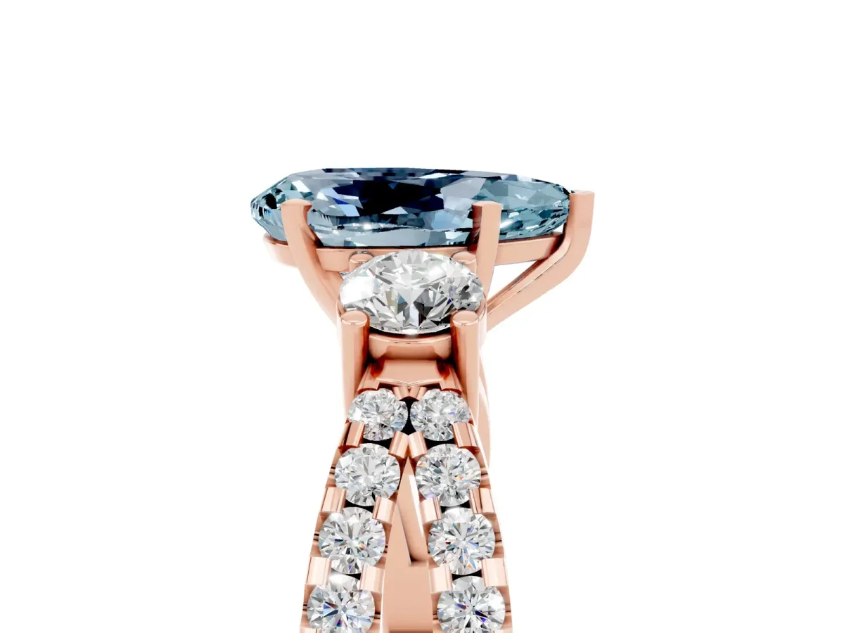 Pear Cut Aquamarine Three-Stone Ring with Pavé Split Shank and Four-Prong Setting Rose gold