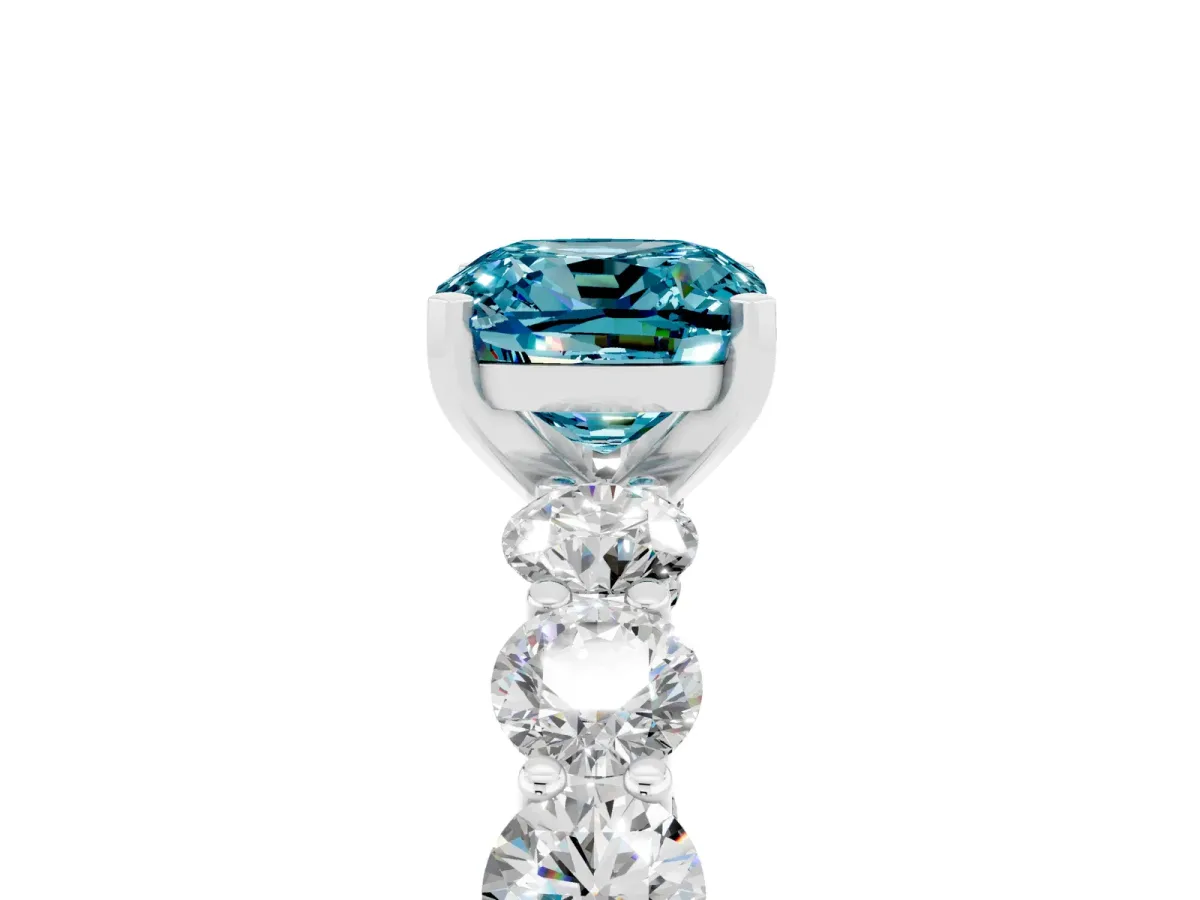 Cushion Cut Blue Topaz Prong Setting with Side Stones on a Pave Band Silver