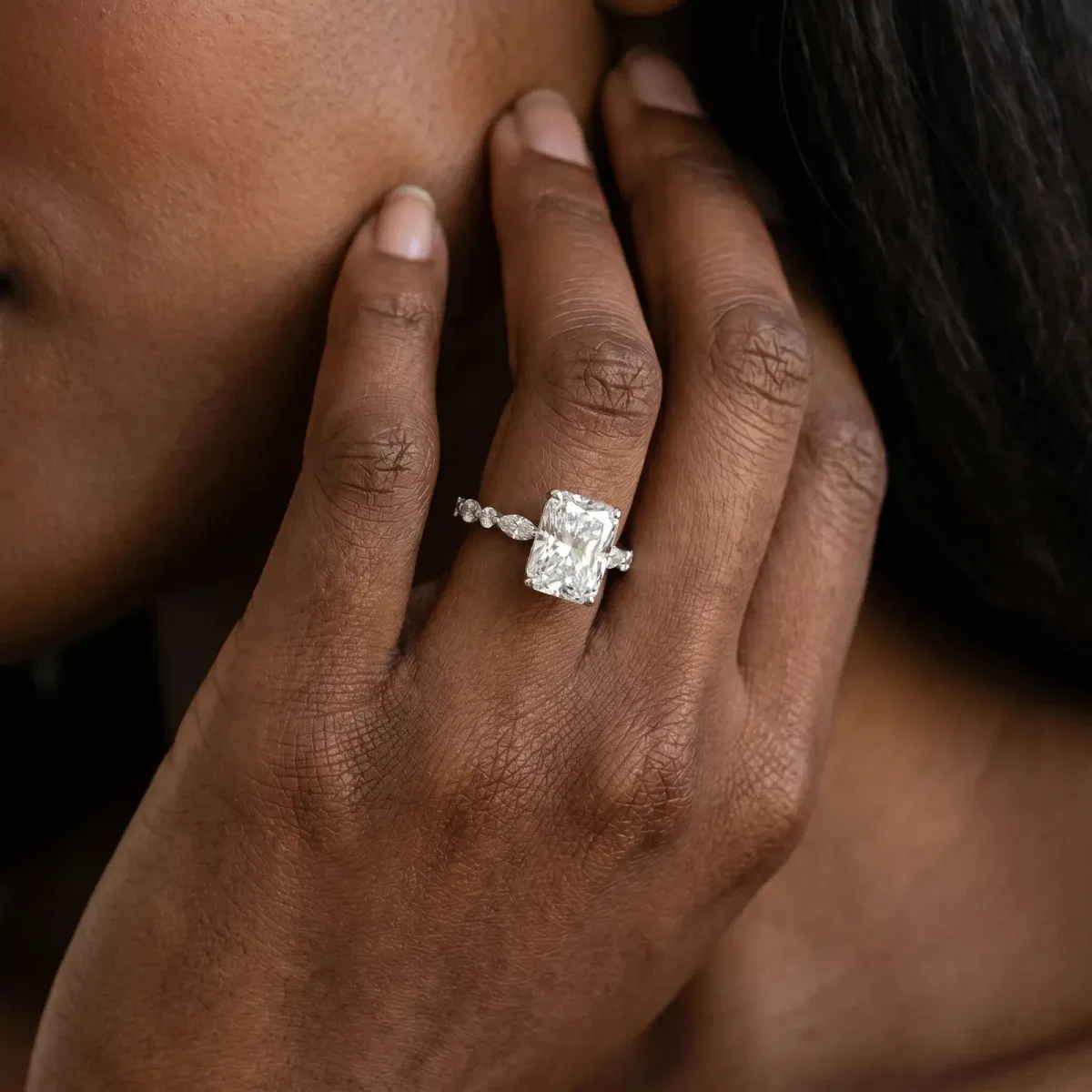 Radiant Cut Diamond Ring with Marquise and Round Side Stones and Four-Prong Setting Silver