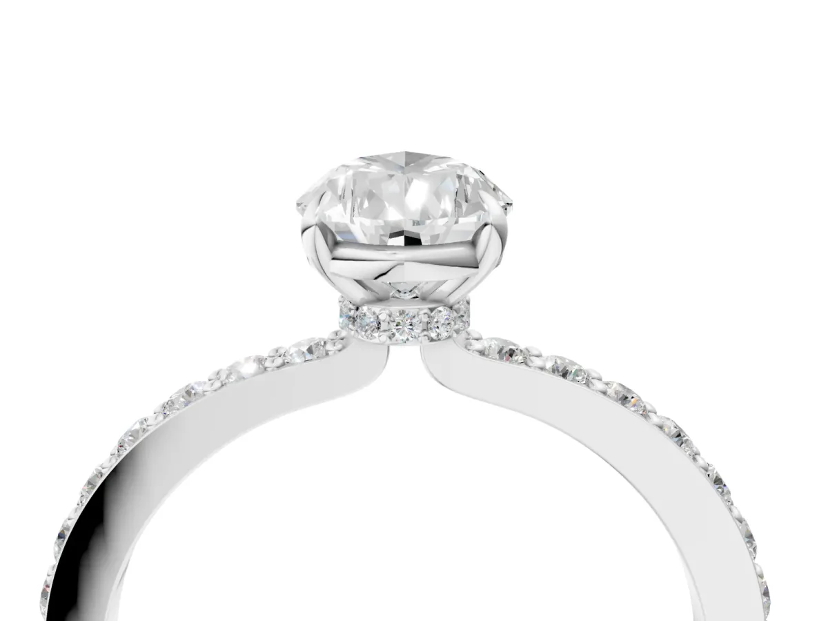 Pear Cut Diamond Solitaire Engagement Ring with Pavé Band and Four-Prong Setting Silver