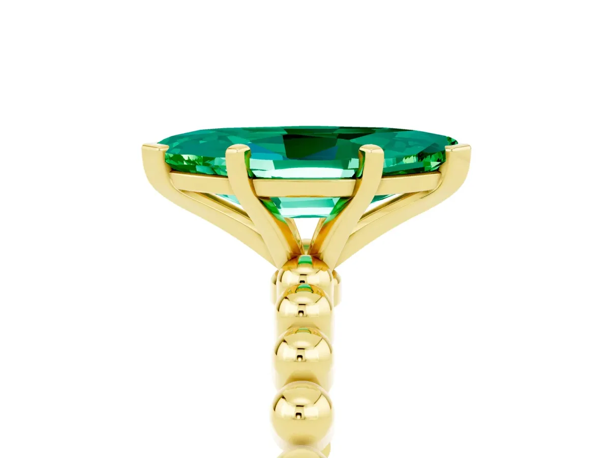 Marquise Cut Emerald Solitaire Ring with Beaded Band and Prong Setting Yellow gold