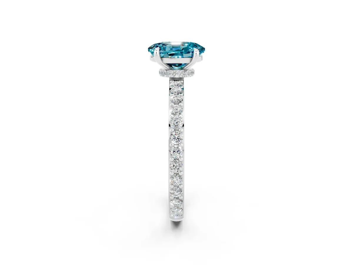 Oval Cut Blue Topaz Solitaire Engagement Ring with Pavé Band and Four-Prong Setting Silver