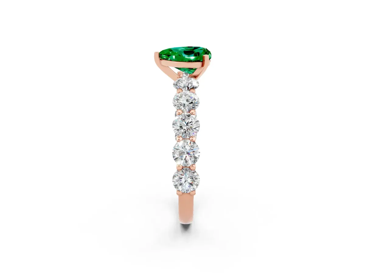 Heart Cut Emerald Prong Setting with Side Stones on a Pave Band Rose gold