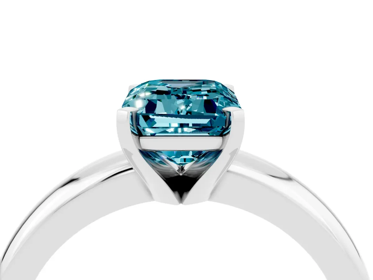 Emerald Cut Blue Topaz Solitaire Engagement Ring with Round Band and Four-Prong Setting Silver