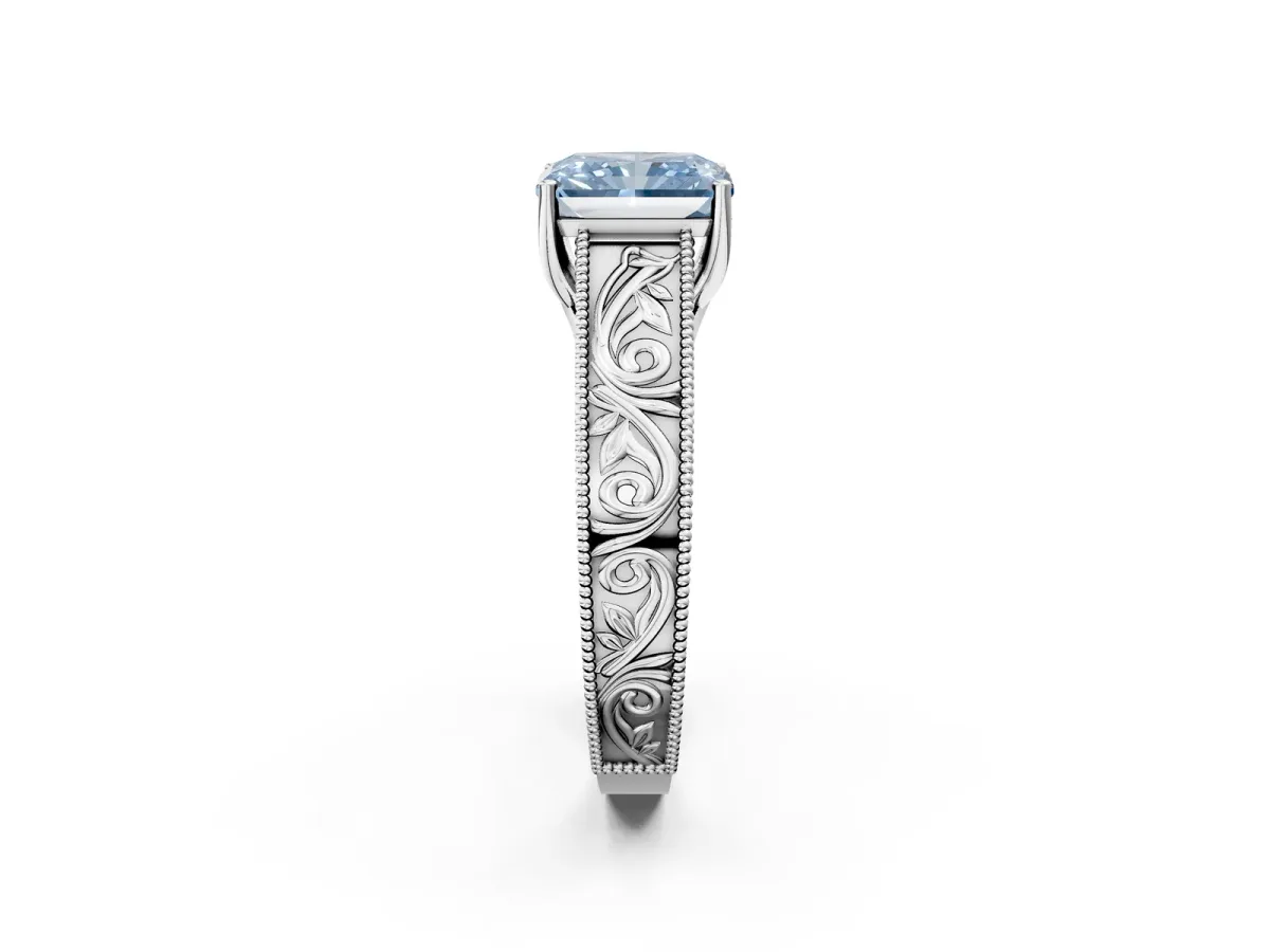 Fancy Blue Radiant Cut Diamond Solitaire Ring with Engraved Band and Four-Prong Setting Platinum