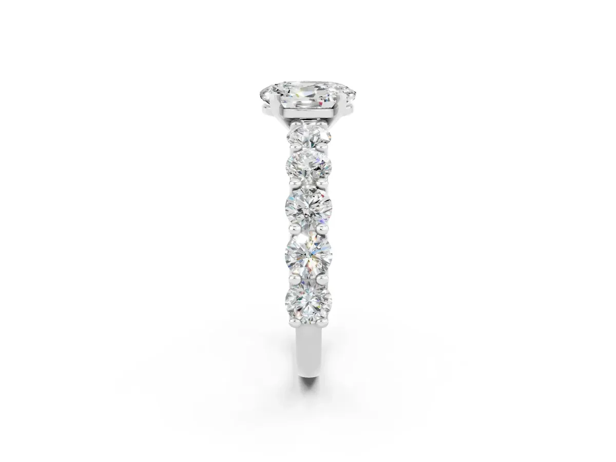 Oval Cut Moissanite Prong Setting with Side Stones on a Pave Band Silver