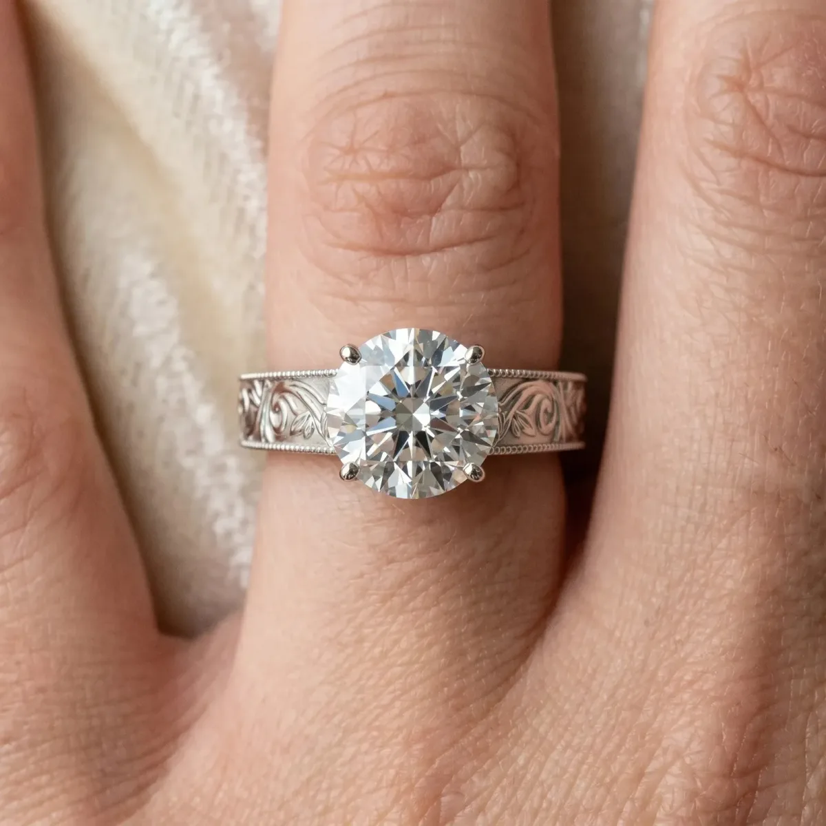 Round Cut Diamond Solitaire Ring with Engraved Band and Four-Prong Setting White gold