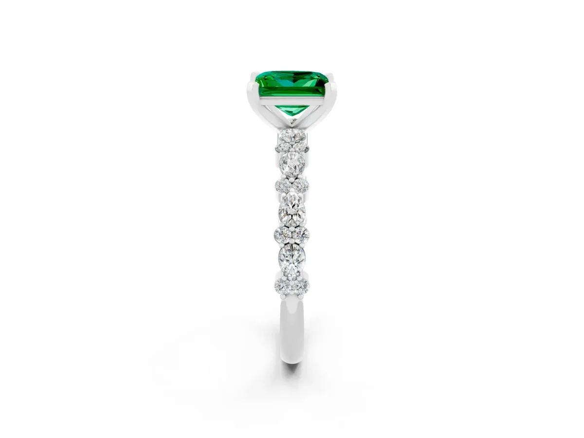 Princess Cut Emerald Side Stone Solitaire Ring with Round and Four-Prong Setting Platinum