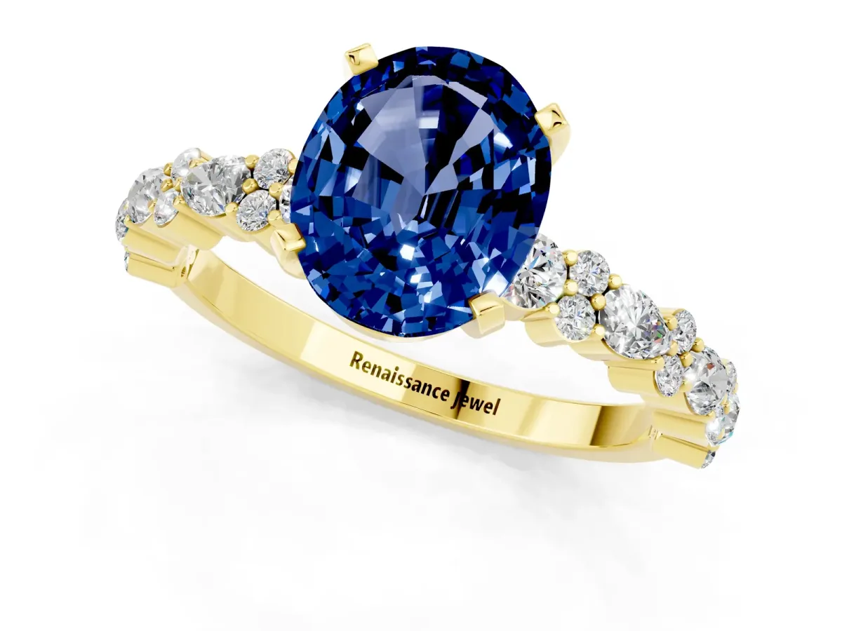 Oval Cut Blue Sapphire Side Stone Solitaire Ring with Round and Four-Prong Setting Yellow gold