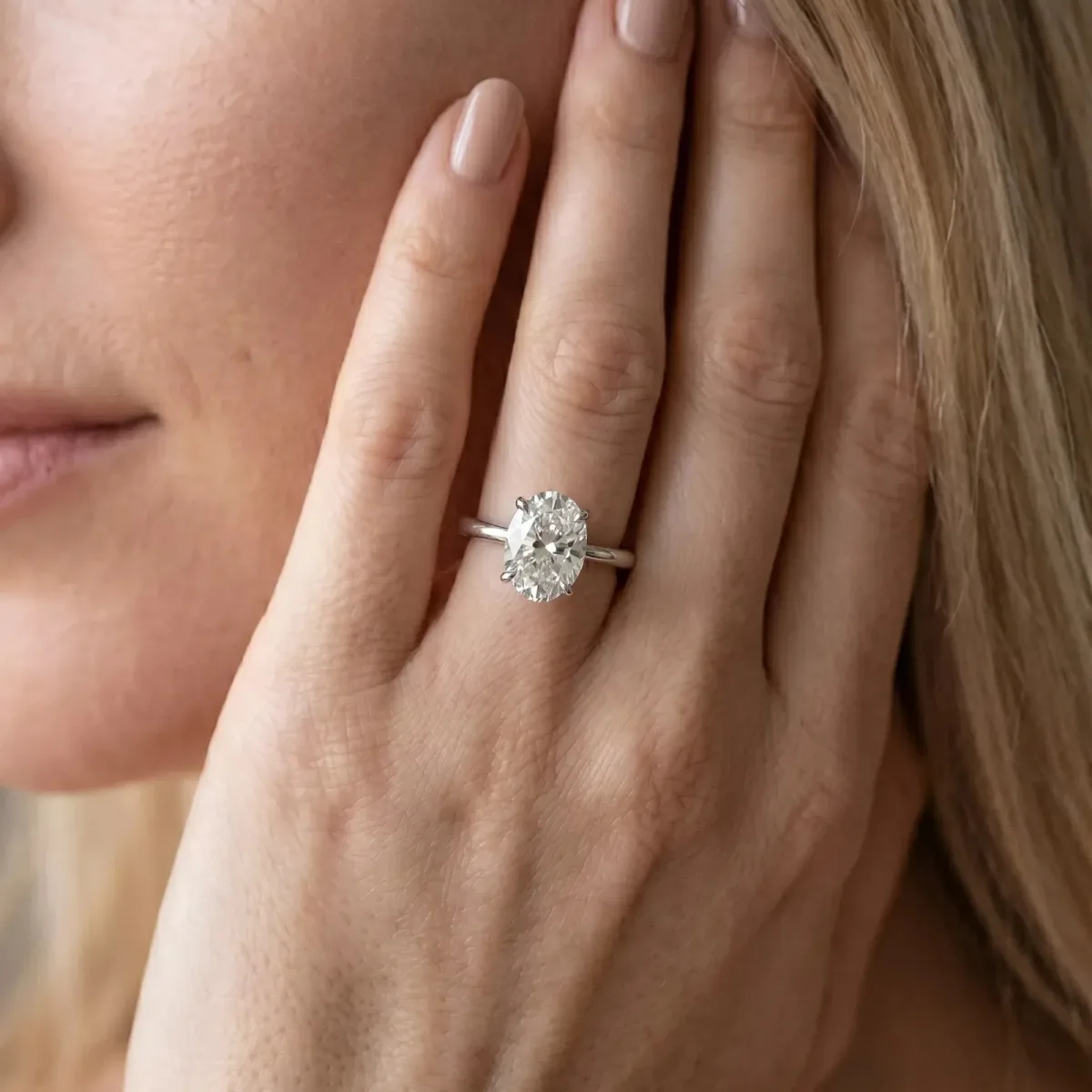 Oval Cut Diamond Solitaire Engagement Ring with Classic Band and Four-Prong Setting Silver
