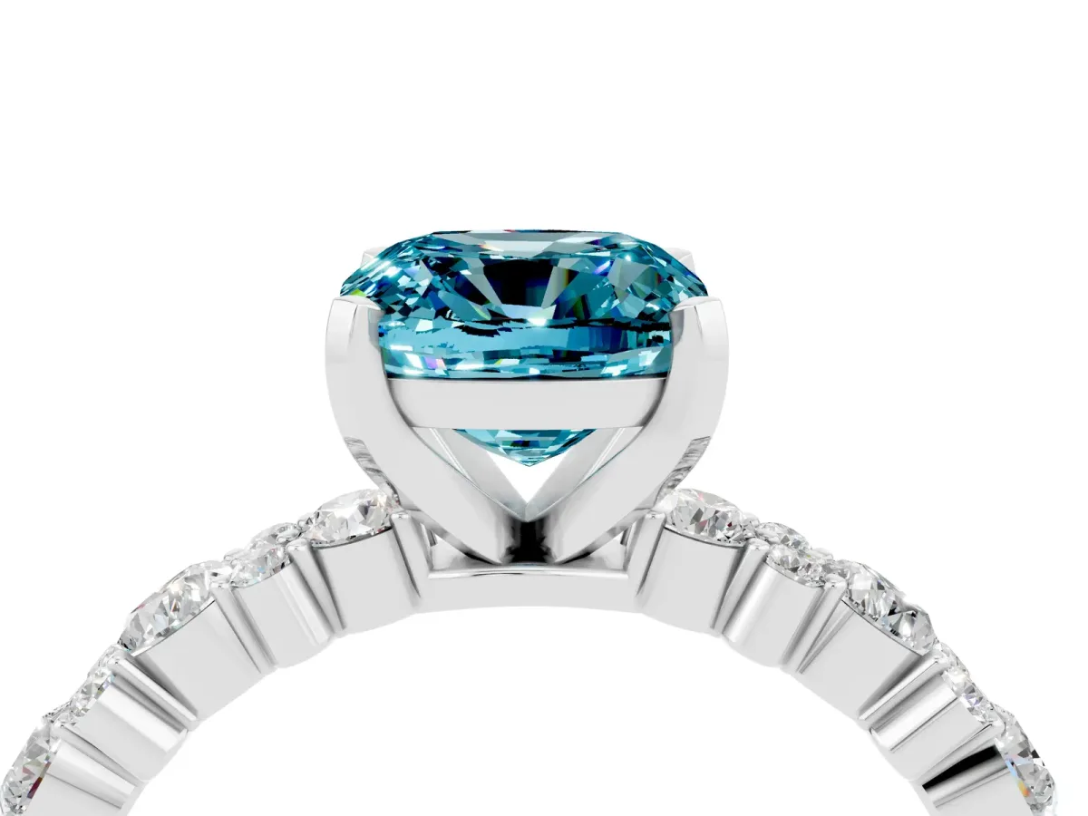 Cushion Cut Blue Topaz Side Stone Solitaire Ring with Round and Four-Prong Setting Platinum