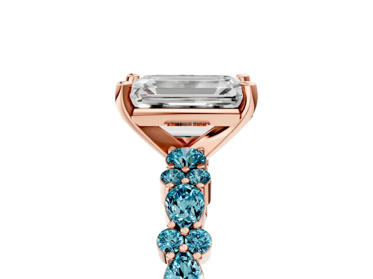 Emerald Cut Diamond Side Stone Solitaire Ring with Round Blue Topaz and Four-Prong Setting Rose gold