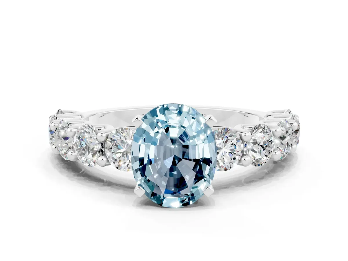 Oval Cut Aquamarine Prong Setting with Side Stones on a Pave Band Silver