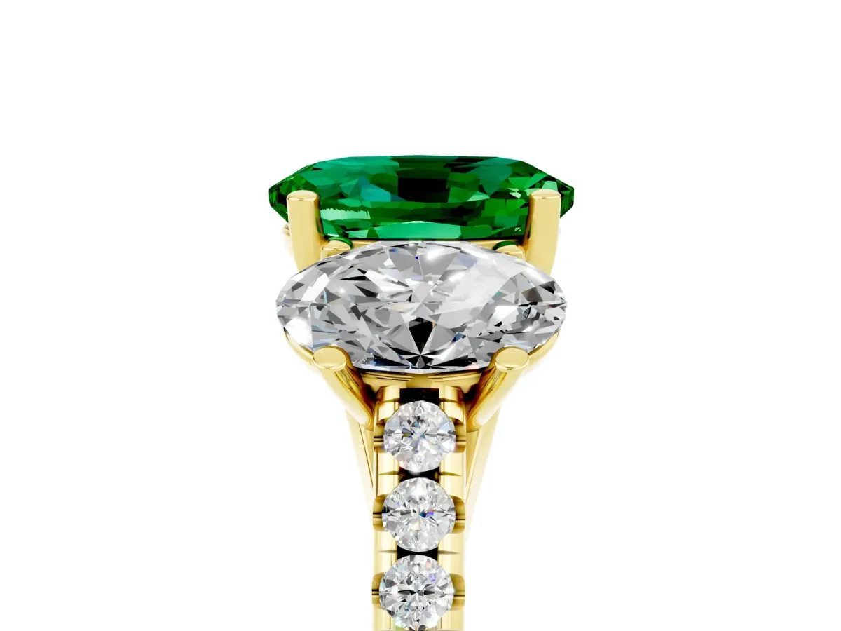 Three-Stone Oval Cut Emerald Ring with Round Pavé Band and Prong Setting Yellow gold