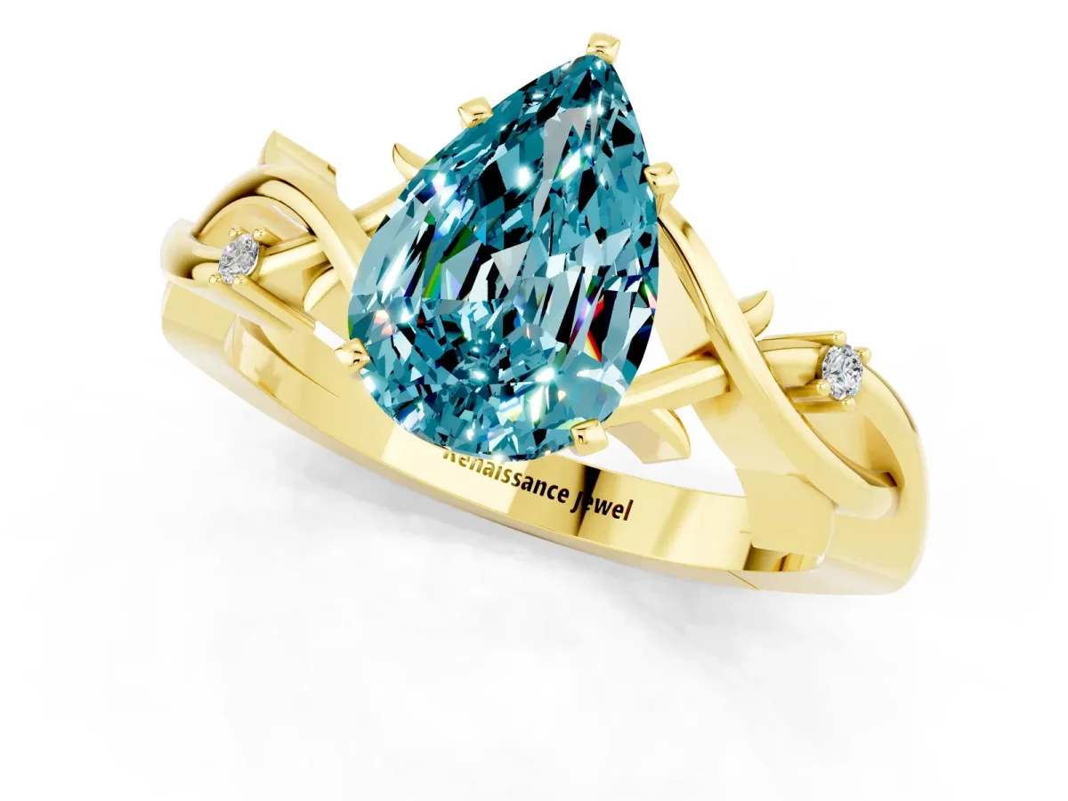 Pear Cut Blue Topaz Solitaire Ring with Twisted Band and Prong Setting Yellow gold