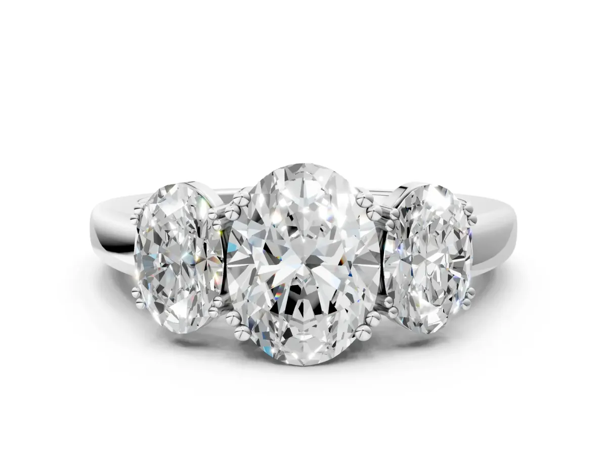 Three-Stone Oval Cut Cut Diamond Ring with Channel Set Band and Four-Prong Setting White gold