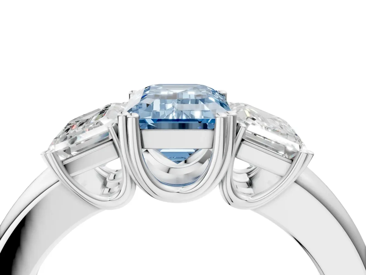 Fancy Blue Three-Stone Emerald Cut Cut Diamond Ring with Channel Set Band and Four-Prong Setting Silver