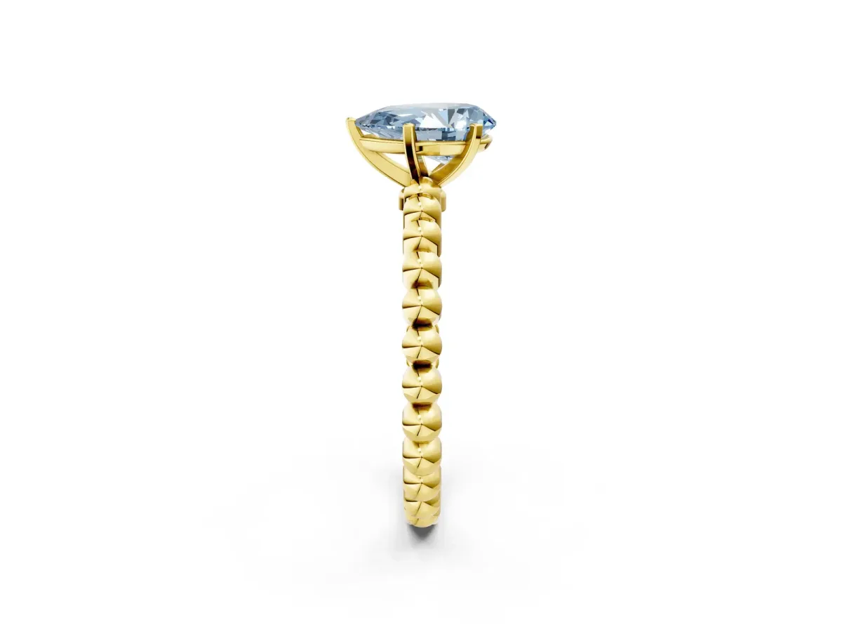 Fancy Blue Pear Cut Diamond Solitaire Ring with Beaded Band and Prong Setting Yellow gold