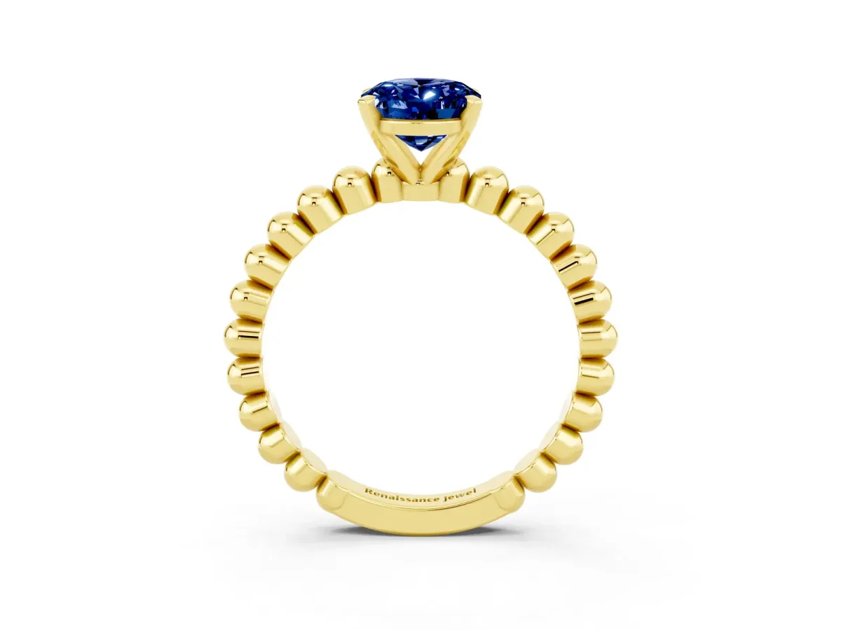 Oval Cut Blue Sapphire Solitaire Ring with Beaded Band and Prong Setting Yellow gold