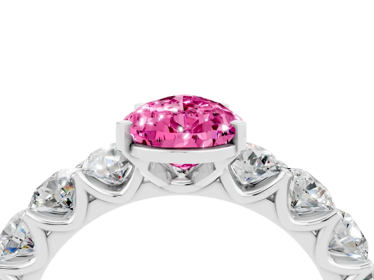 Pear Cut Pink Sapphire Prong Setting with Side Stones on a Pave Band Silver
