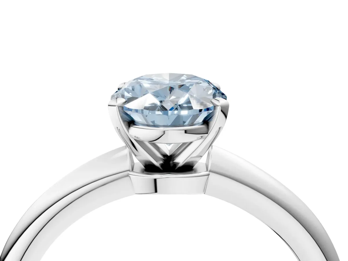 Fancy Blue Oval Cut Diamond Solitaire Ring with Six-Prong Setting and Classic Band Platinum