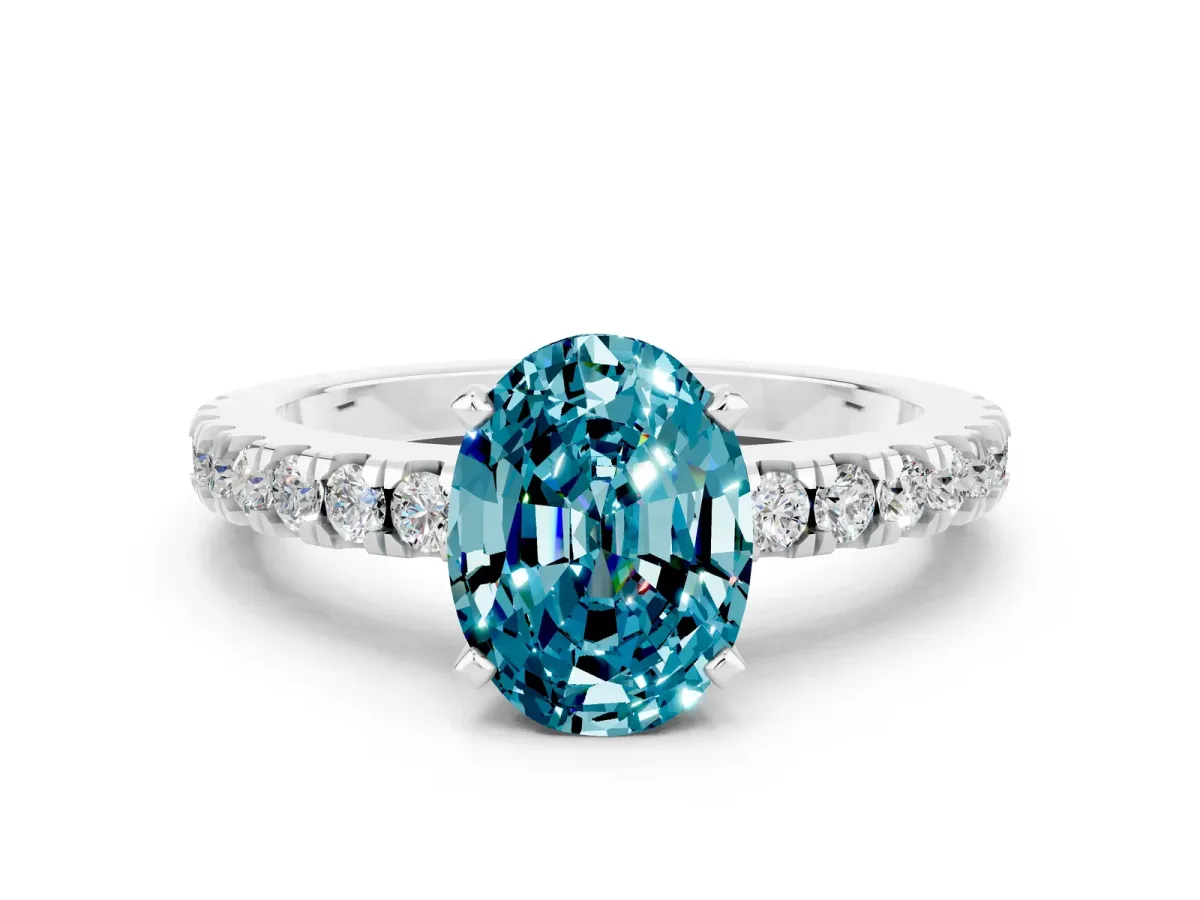 Oval Cut Solitaire Blue Topaz with Pavé Band and Four-Prong Setting Silver