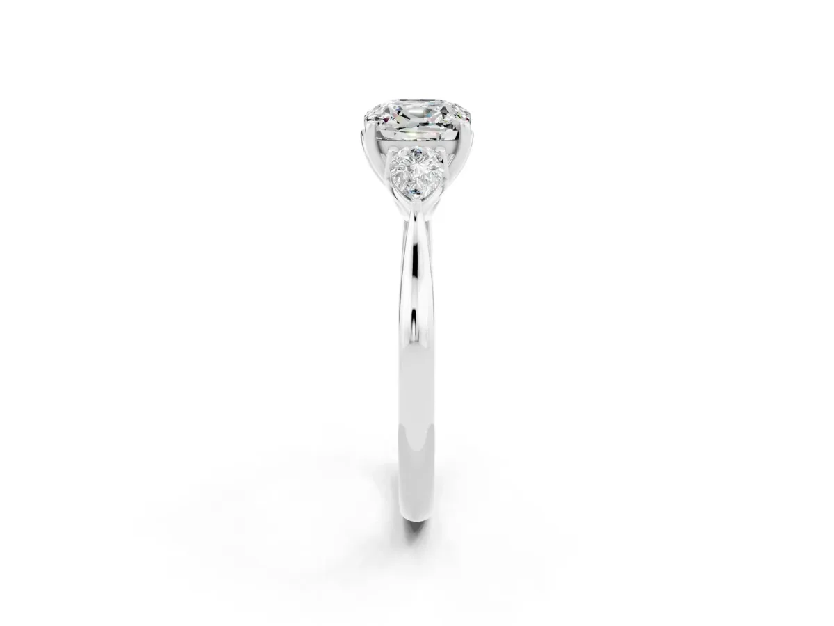 Three-Stone Cushion Cut Moissanite Ring with Pear Side Stones in Four-Prong Setting White gold