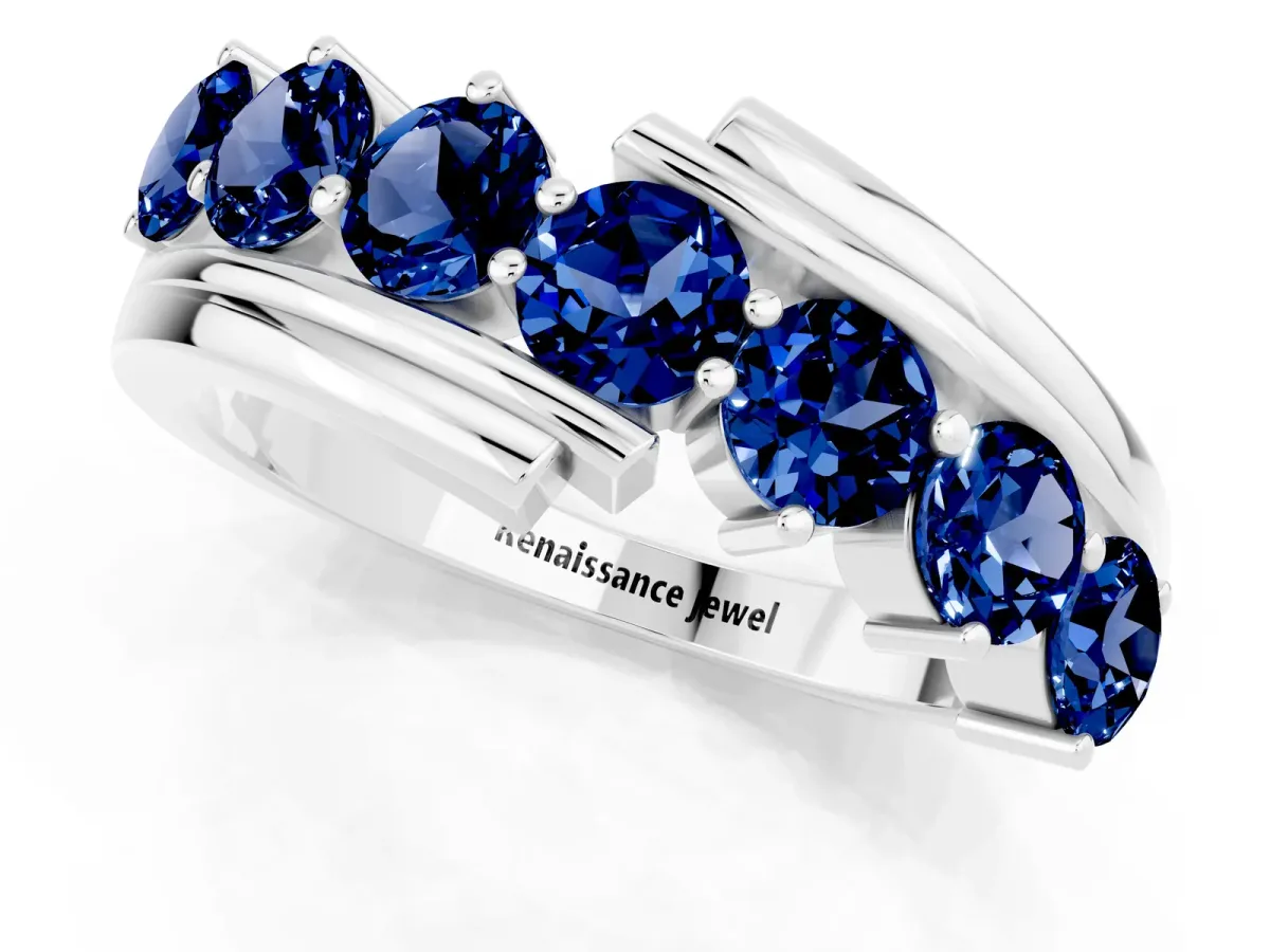 Round Blue Sapphire Wave Band with Channel and Shared Prong Setting Silver