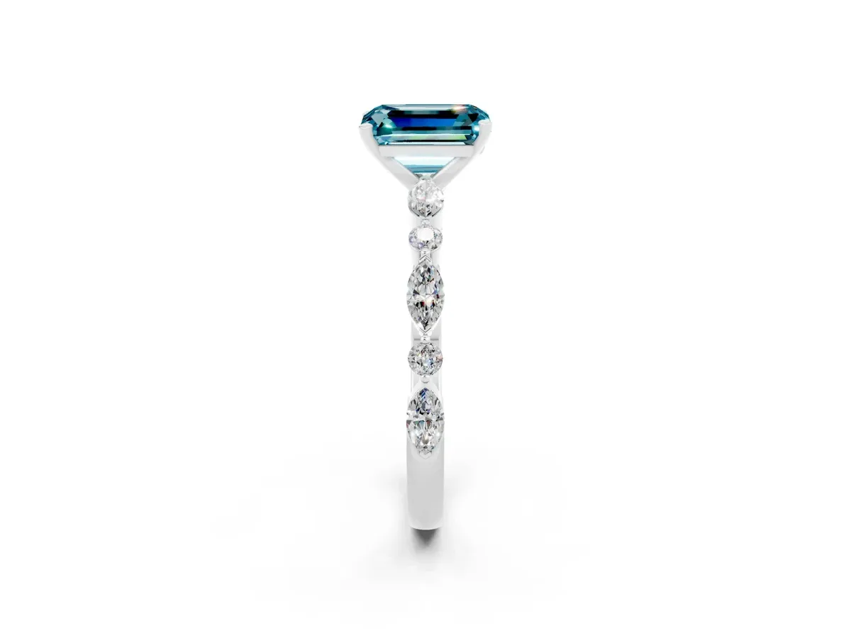 Emerald Cut Blue Topaz Ring with Marquise and Round Side Stones and Four-Prong Setting Silver