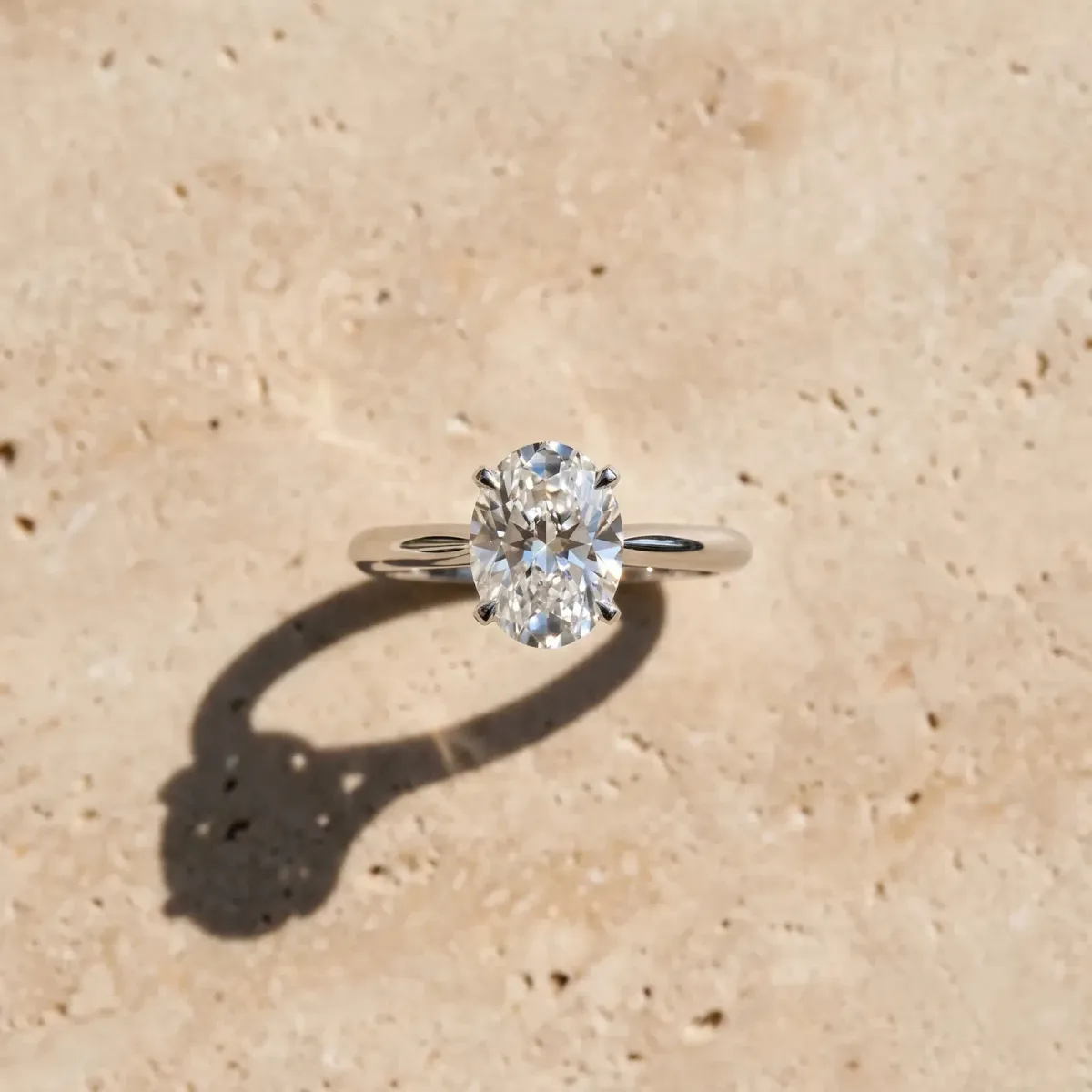 Oval Cut Diamond Solitaire Engagement Ring with Classic Band and Four-Prong Setting Silver