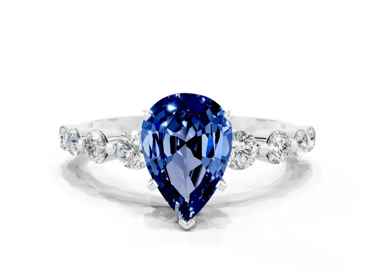 Pear Cut Solitaire Blue Sapphire Ring with Pave Band and Four-Prong Setting Platinum