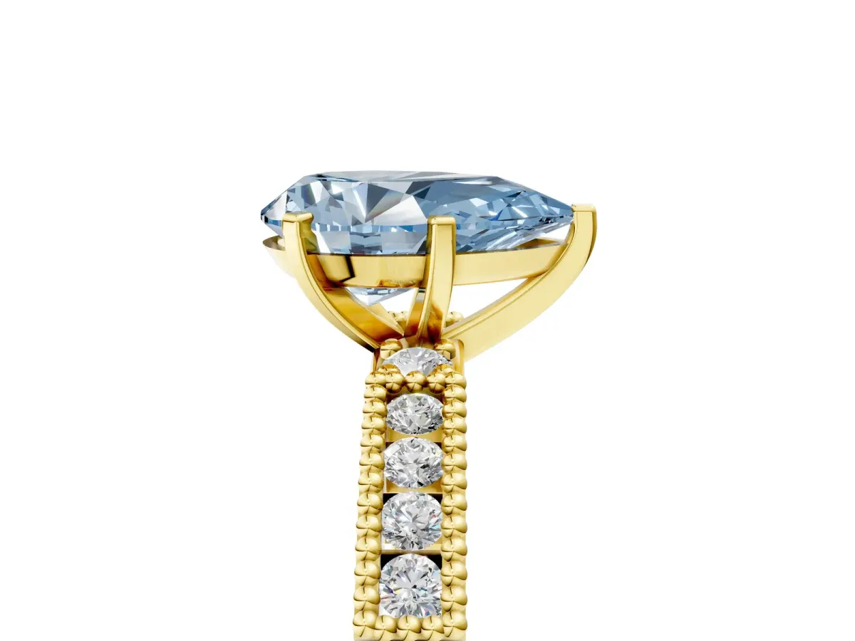 Fancy Blue Pear Cut Solitaire with Pavé Band and Four-Prong Setting Yellow gold