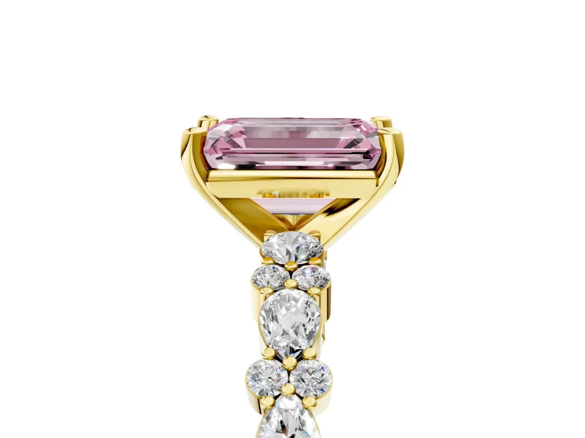 Fancy Pink Emerald Cut Diamond Side Stone Solitaire Ring with Round and Four-Prong Setting Yellow gold
