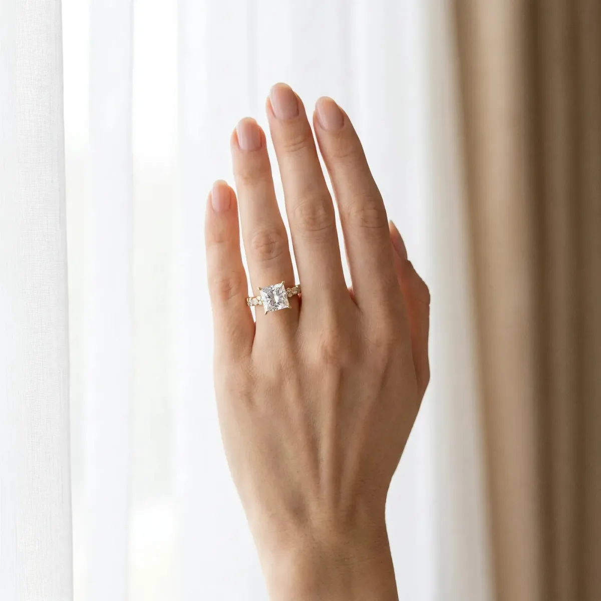 Princess Cut Diamond Side Stone Solitaire Ring with Round and Four-Prong Setting Yellow gold