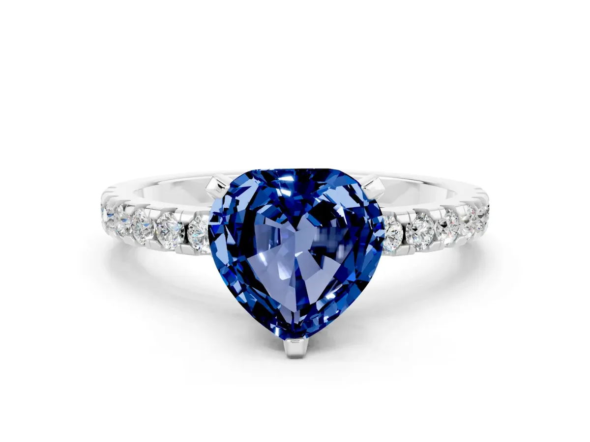 Heart Cut Blue Sapphire Solitaire Ring with Round Pavé Band and Four-Prong Setting Silver