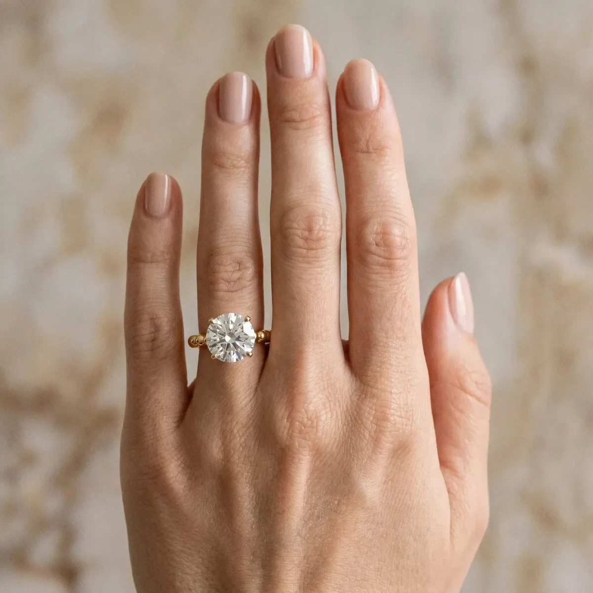 Round Cut Diamond Solitaire Ring with Beaded Band and Prong Setting Yellow gold