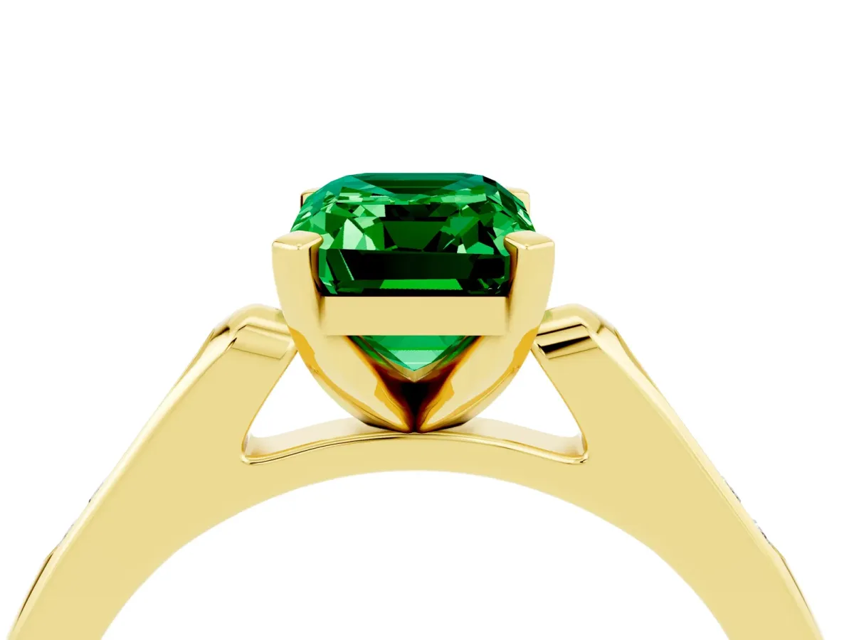 Emerald Cut Emerald Solitaire Ring with Channel Set Round Band and Prong Setting Yellow gold