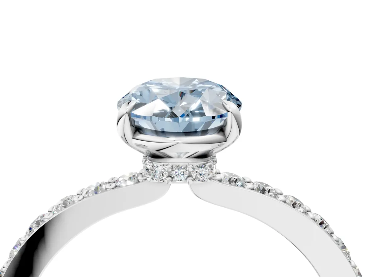 Fancy Blue Oval Cut Diamond Solitaire Engagement Ring with Pavé Band and Four-Prong Setting Silver