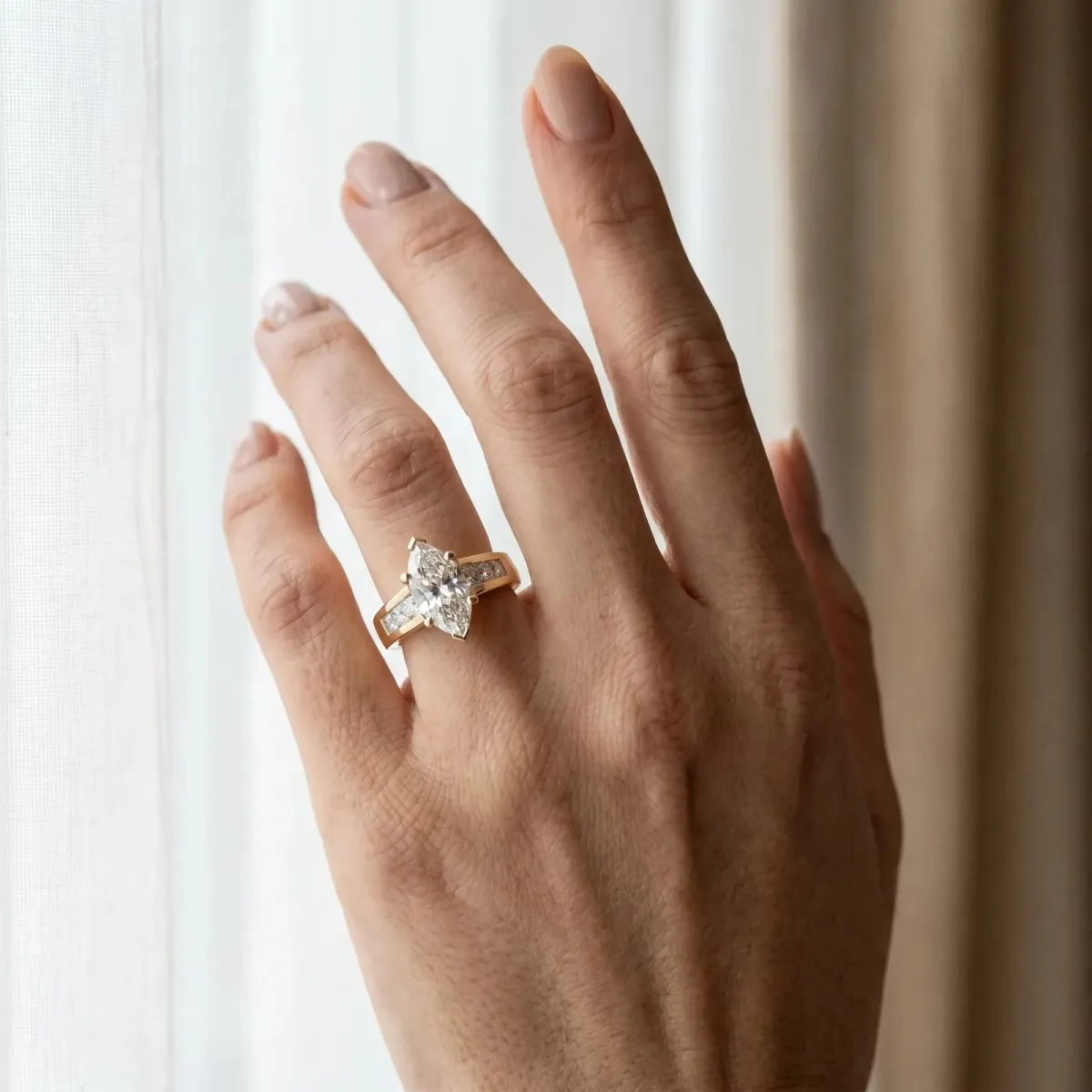 Marquise Cut Cut Channel Set Solitaire Ring with Four-Prong Setting Yellow gold