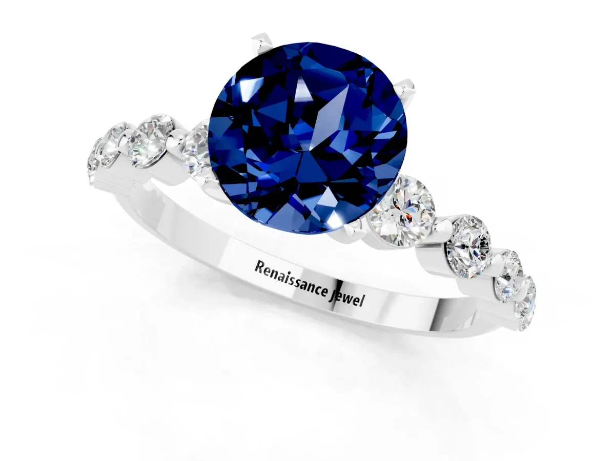 Round Cut Solitaire Blue Sapphire Ring with Pave Band and Four-Prong Setting Silver