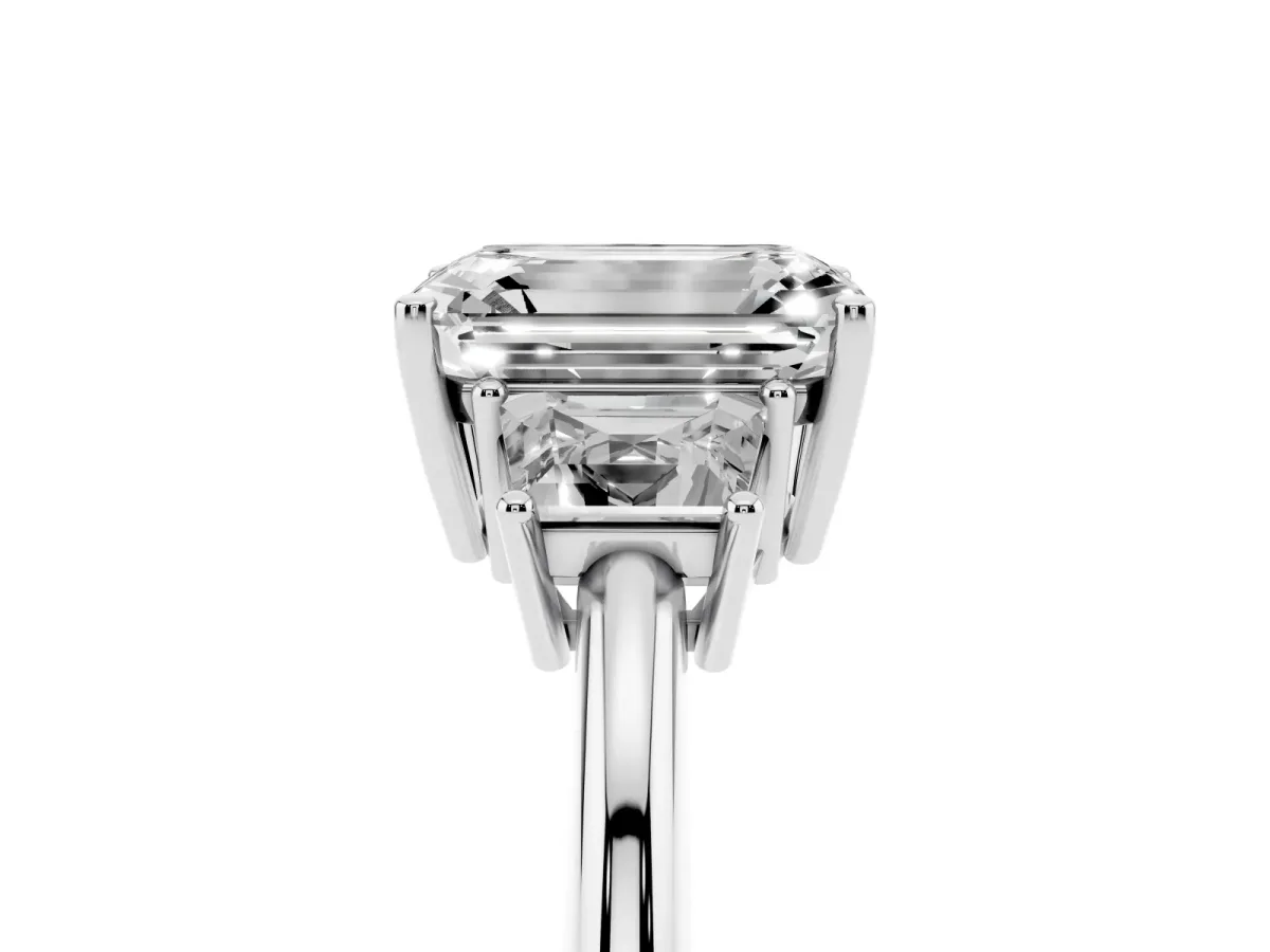 Emerald Cut Diamond Three-Stone Ring with Trapezoid Side Stones and Prong Setting White gold