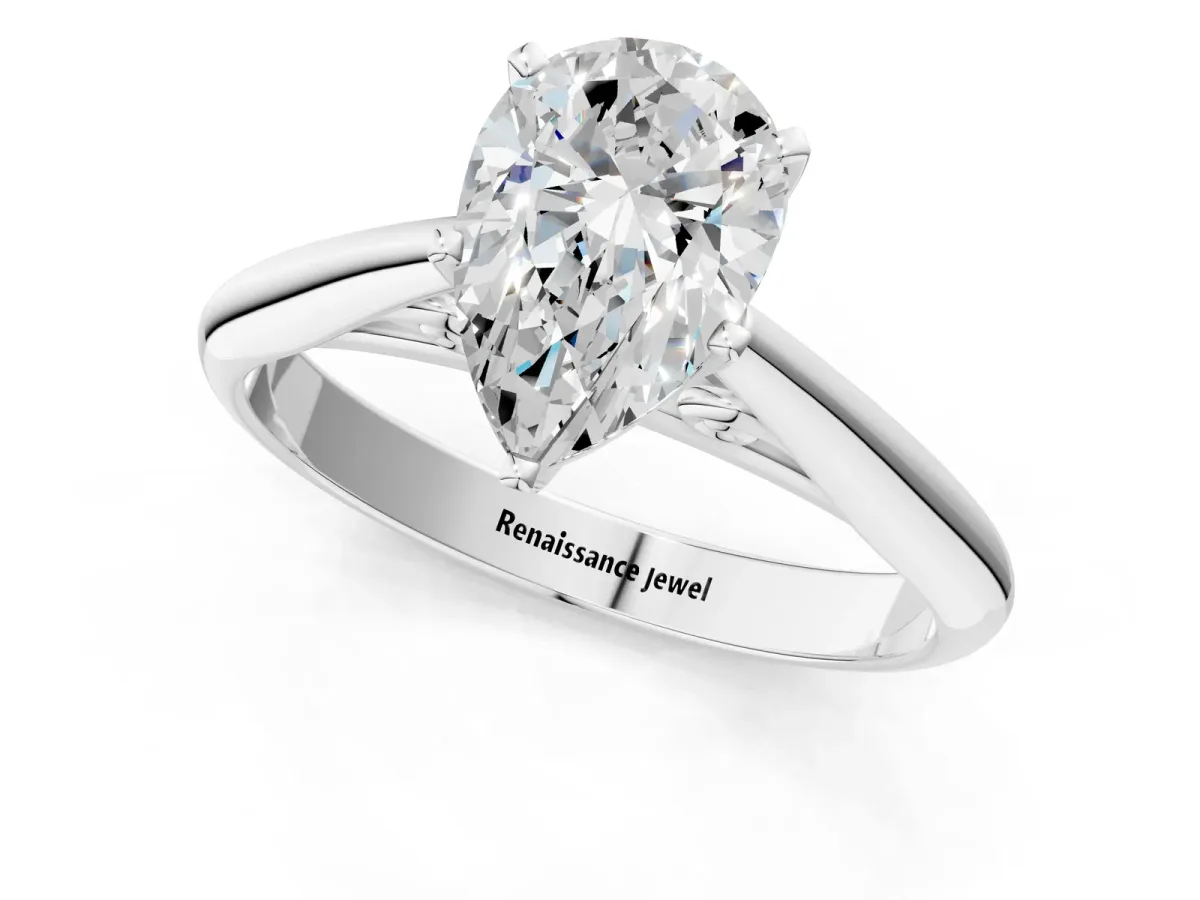 Pear Cut Diamond Solitaire Engagement Ring with Cathedral Setting and Four-Prong Mount White gold