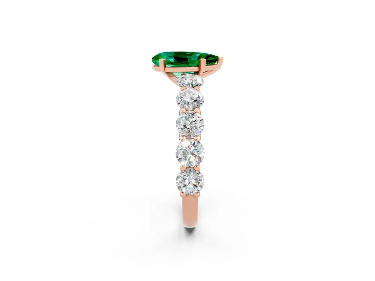 Pear Cut Emerald Prong Setting with Side Stones on a Pave Band Rose gold