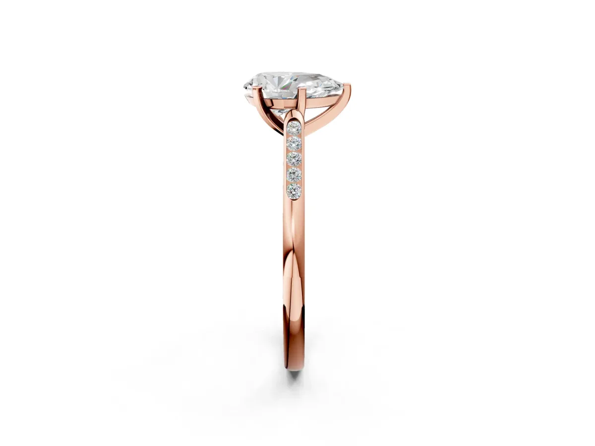 Pear Cut Diamond Solitaire Ring with Channel Set Round Band and Prong Setting Rose gold